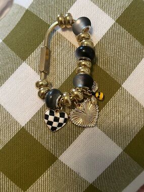 Caribina Gold Tone Charm with Black Beads and Heart Charms.